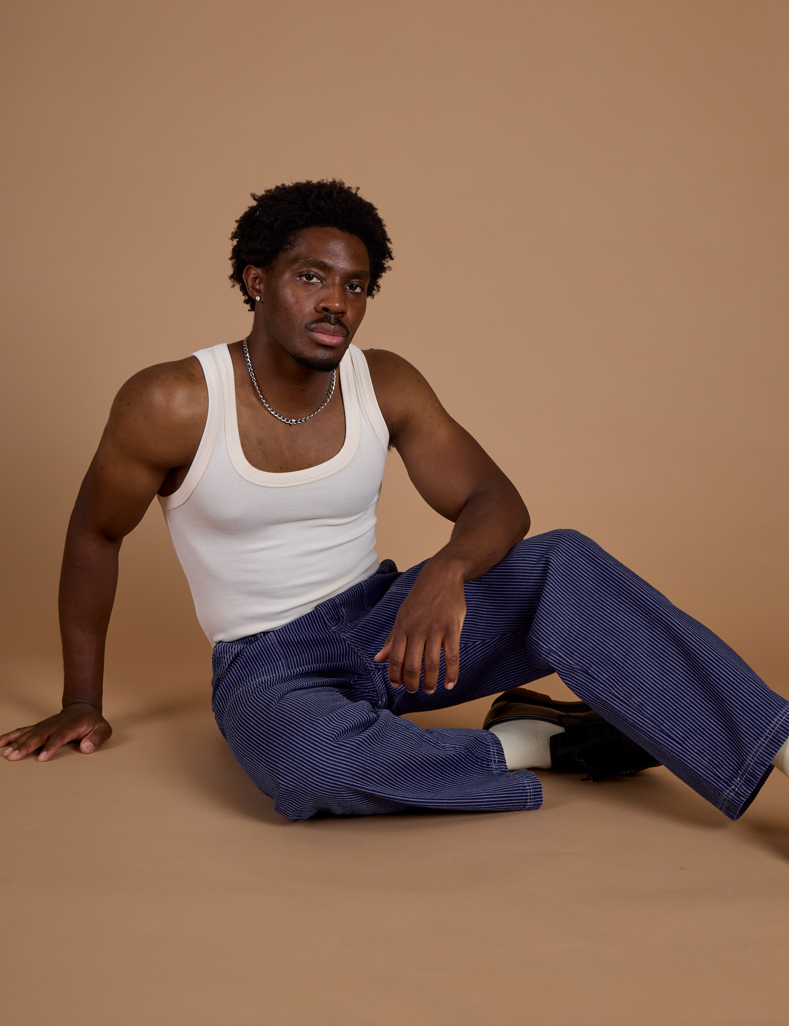 Railroad Denim Work Pants in Faded Grape Overdye and Tank Top in Vintage Tee Off-White on Isaac
