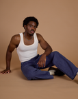 Railroad Denim Work Pants in Faded Grape Overdye and Tank Top in Vintage Tee Off-White on Isaac