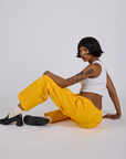 Drop Pocket Cargo Pants in Sunshine Yellow and vintage tee white Cropped Tank on Kira