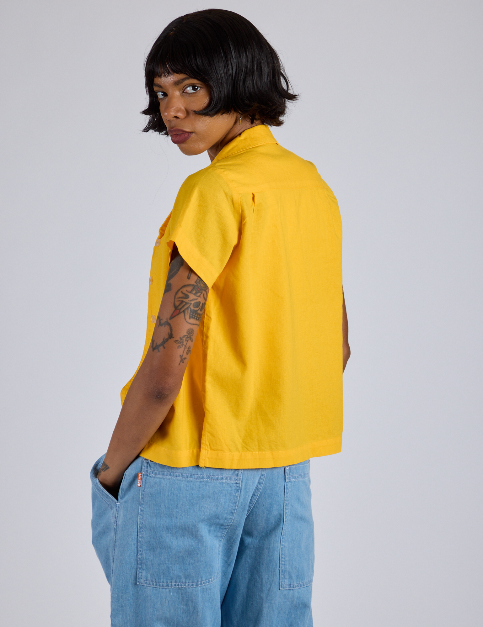 Pantry Button-Up in Sunshine Yellow angled back view on Kira