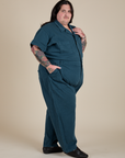 Angled front view of Short Sleeve Jumpsuit in Lagoon on Sam