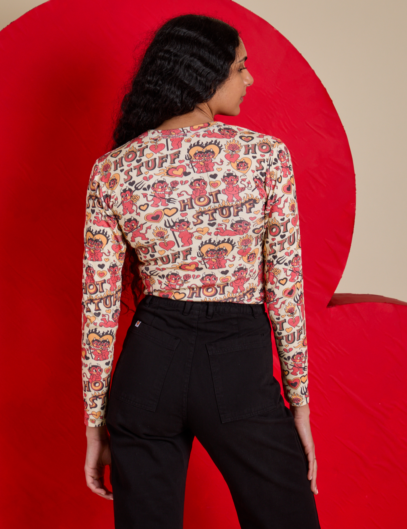 Back view of Long Sleeve Baby Tee in Hot Stuff Print on Shahana