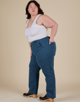 Side view of Work Pants in Lagoon and vintage tee white Cropped Tank on Ashley