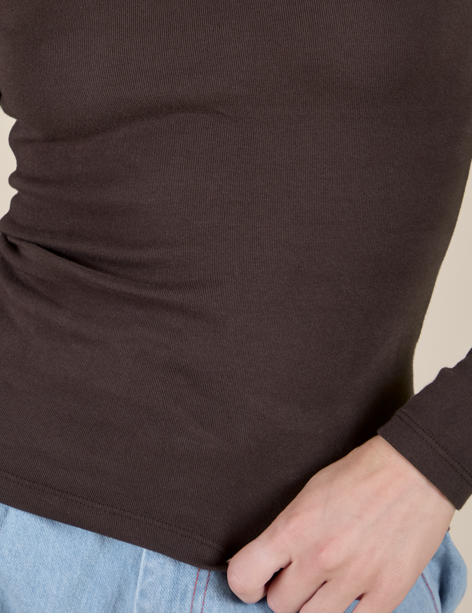 Long Sleeve Baby Tee in Espresso Brown close up on Alex