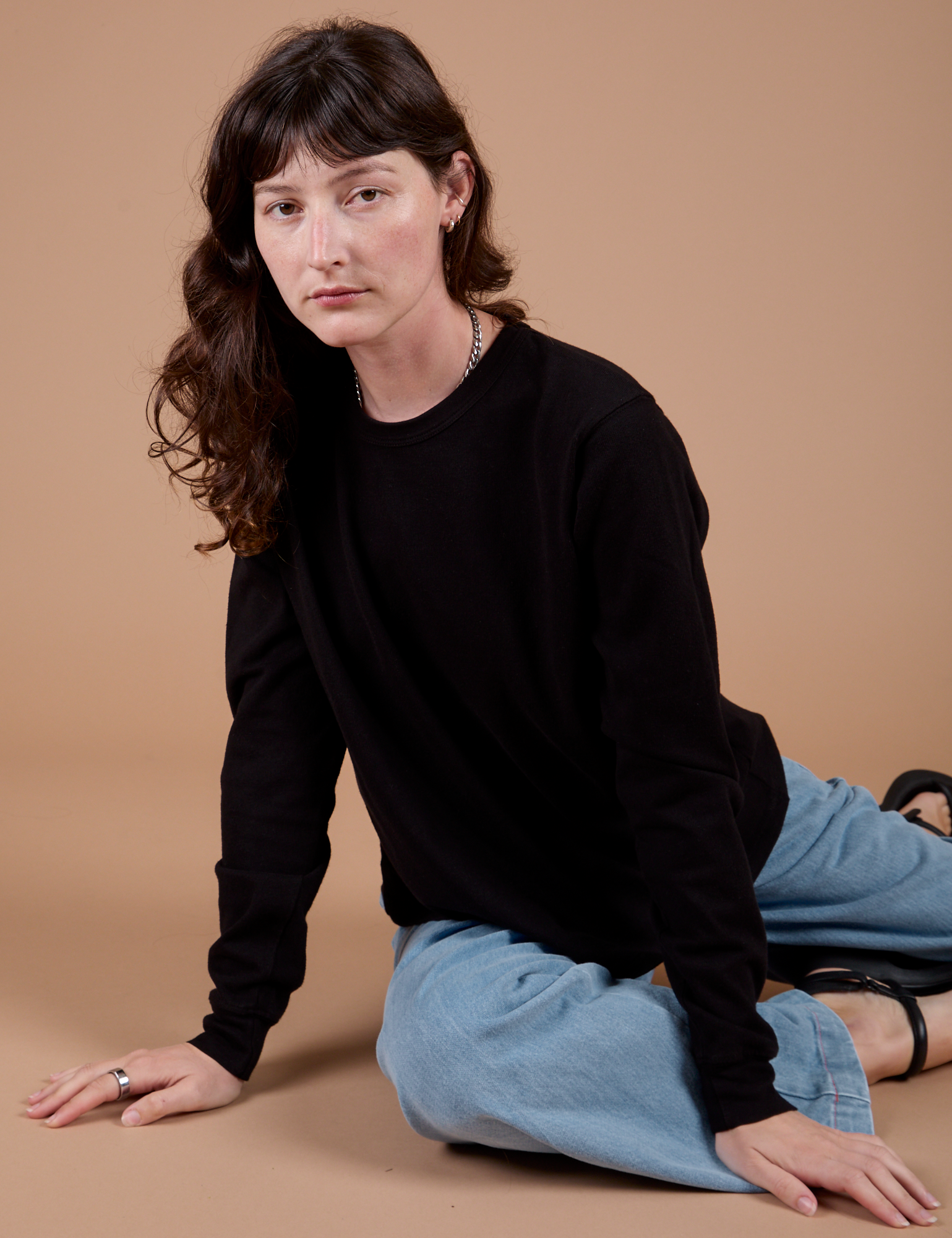 Alex is wearing Long Sleeve Burly Tee in Basic Black