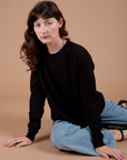 Alex is wearing Long Sleeve Burly Tee in Basic Black