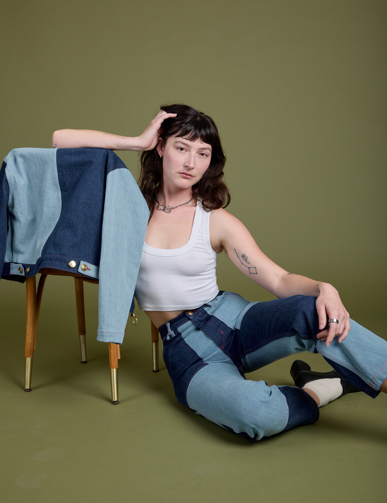 Alex is wearing Mismatched Denim Carpenter Jeans and Cropped Tank in Vintage Tee White