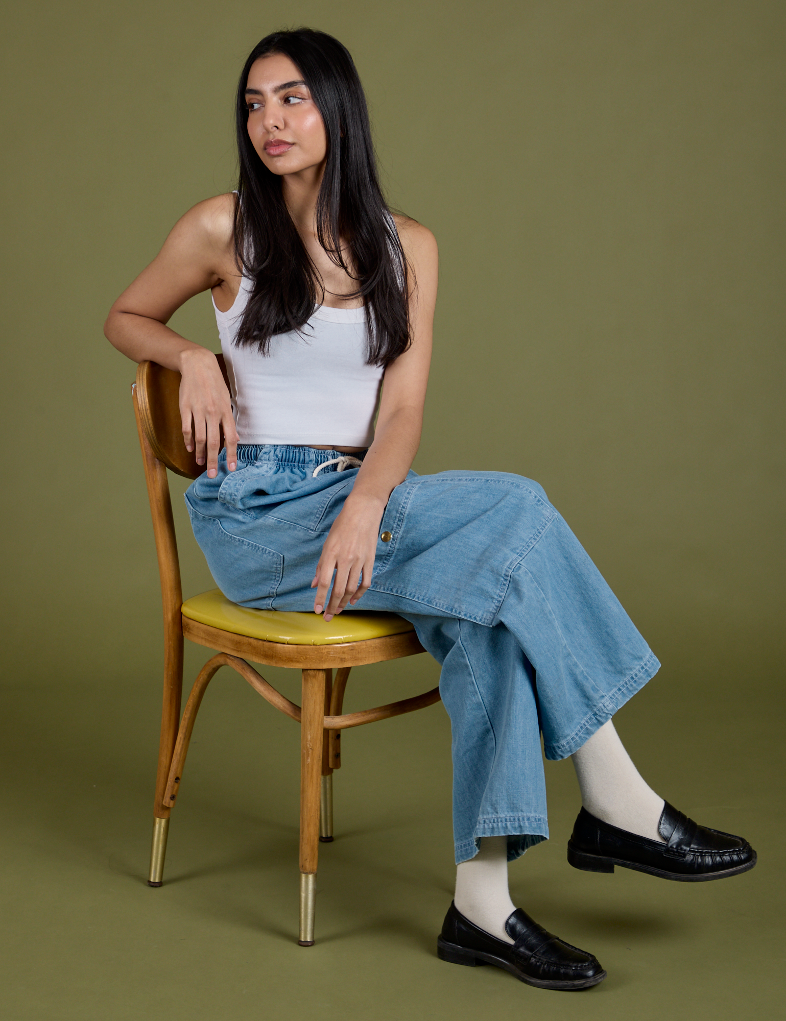 Anjaline is wearing Denim Drop Pocket Pants in Light Wash and Cropped Tank in Vintage Tee White