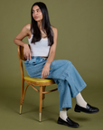 Anjaline is wearing Denim Drop Pocket Pants in Light Wash and Cropped Tank in Vintage Tee White