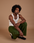 Drop Pocket Cargo Pants in Evergreen and Tank Top in vintage tee white worn by Jerrod