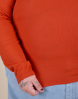 Long Sleeve Baby Tee in Chili Red bottom close up