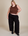 Juliet is wearing Muscle Tee in Fudgesicle Brown paired with black Drop Pocket Cargo Pants