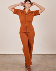 Tiara is wearing Short Sleeve Jumpsuit in Burnt Terracotta