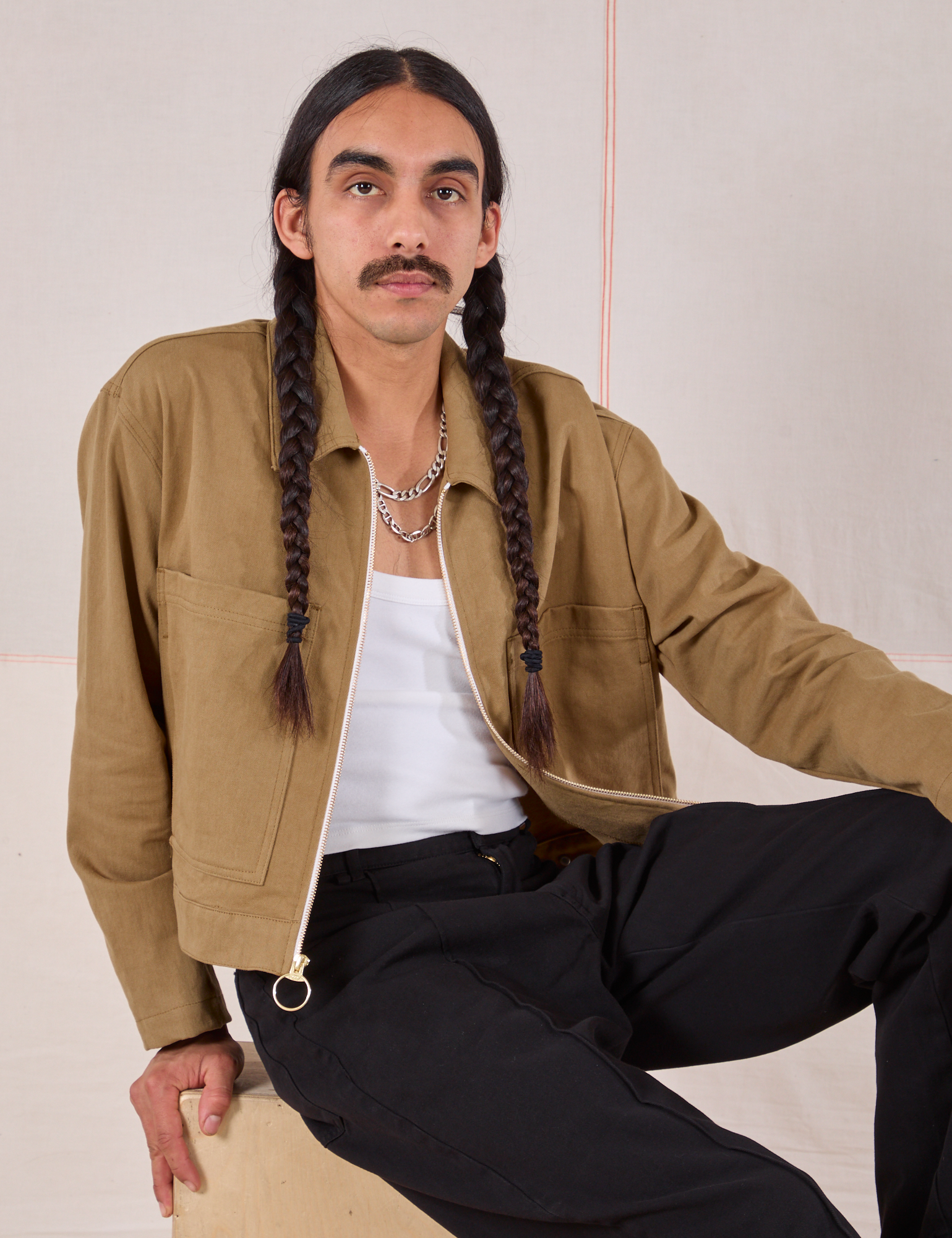 Anthony is wearing Mechanic Jacket in Desert Brown