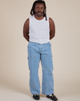 Muscle Tee in Vintage Tee White and light wash Carpenter Jeans on Demi
