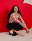 Long Sleeve Baby Tee in Hot Stuff Print and black Western Pants worn by Shahana