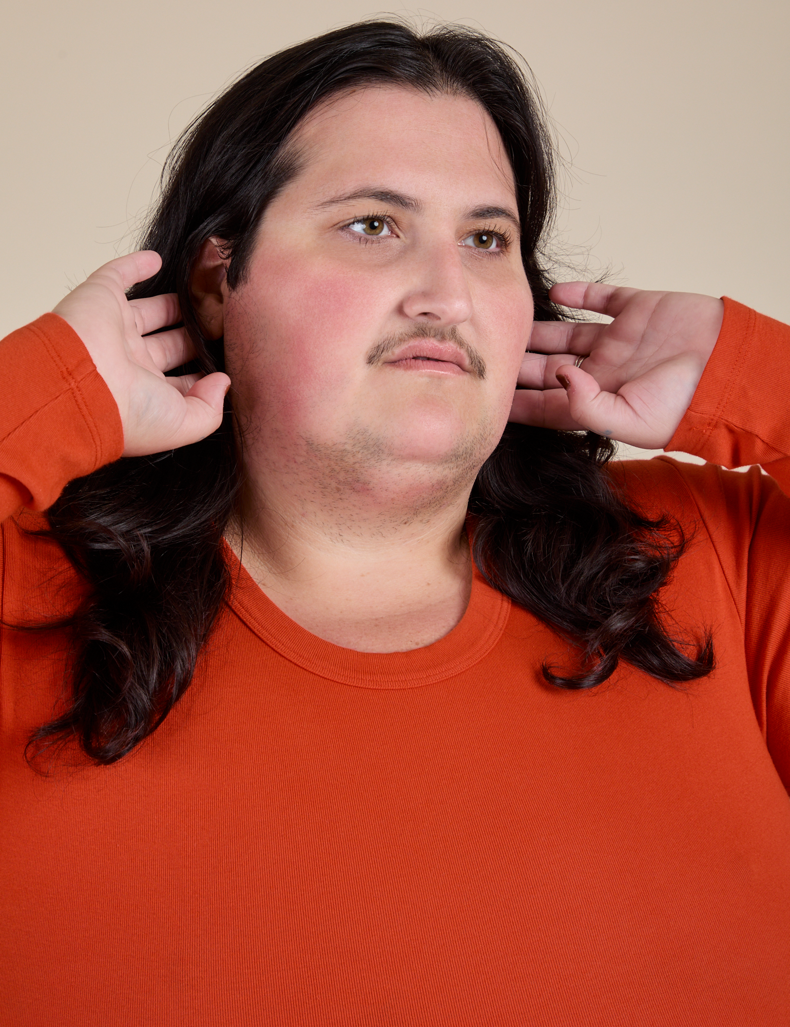 Long Sleeve Baby Tee in Chili Red front close up on Sam