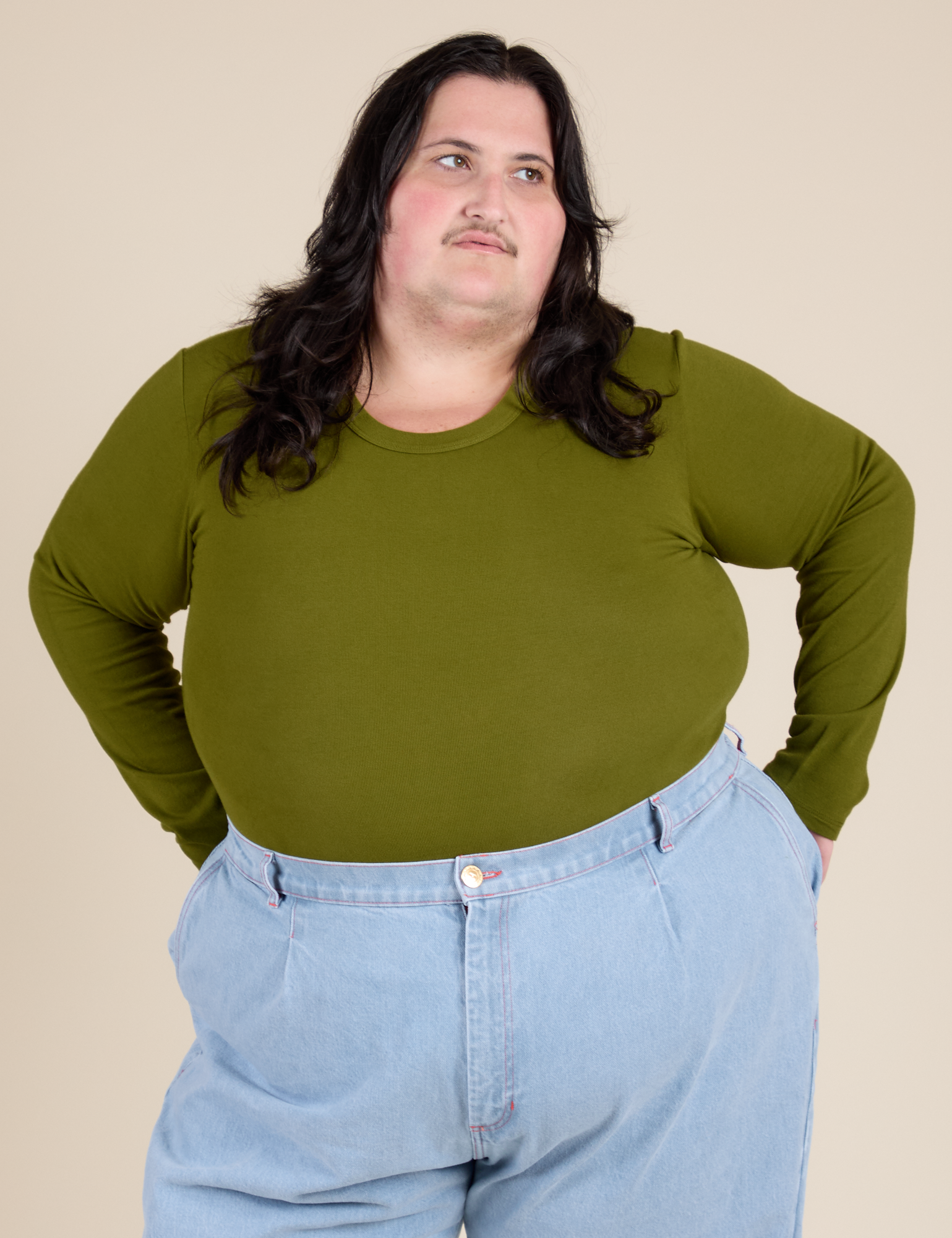 Sam is 5’10” and wearing XL Long Sleeve Baby Tee in Summer Olive
