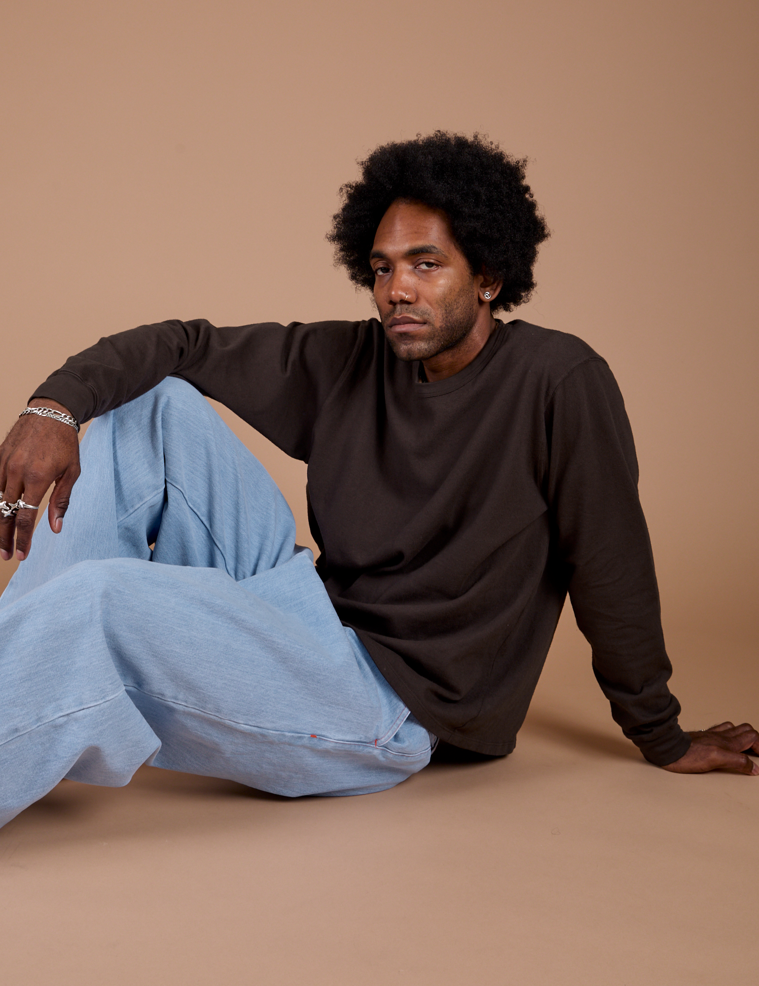 Jerrod is wearing Long Sleeve Burly Tee in Espresso Brown