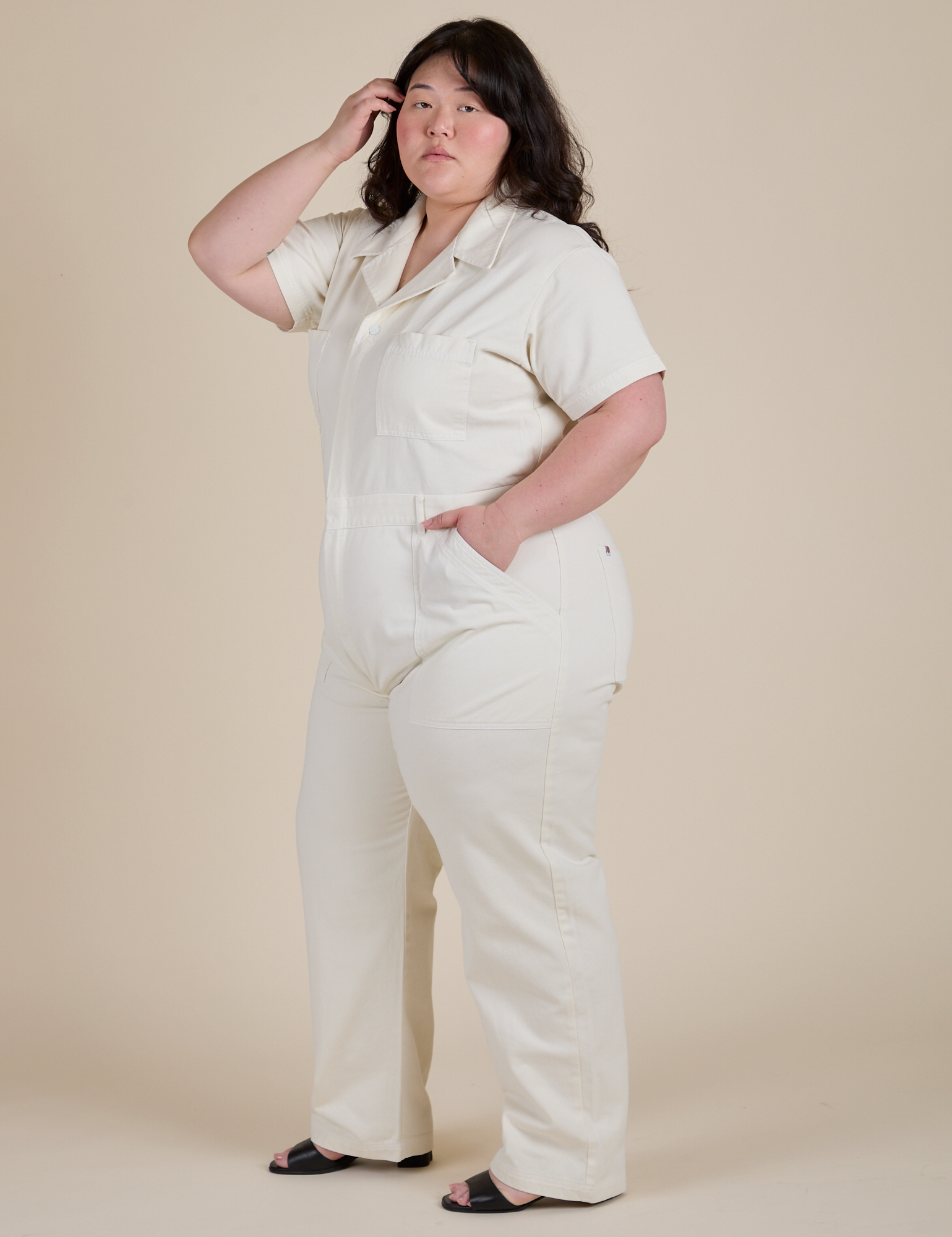 Angled front view of Short Sleeve Jumpsuit in Vintage Tee White on Ashley