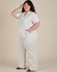 Angled front view of Short Sleeve Jumpsuit in Vintage Tee White on Ashley