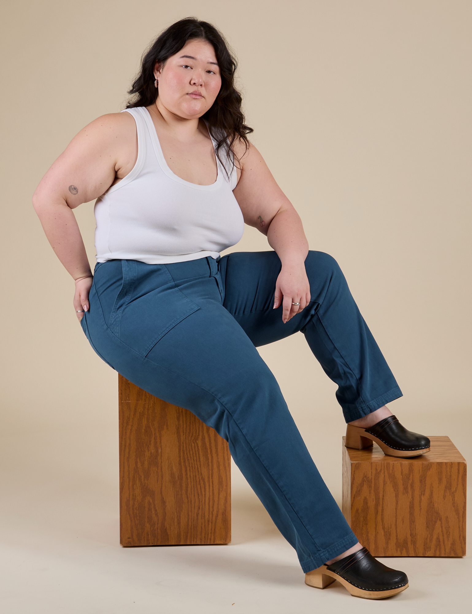 Ashley is wearing Work Pants in Lagoon and vintage tee white Cropped Tank