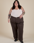 Sam is wearing Work Pants in Espresso Brown and vintage tee off-white Tank Top