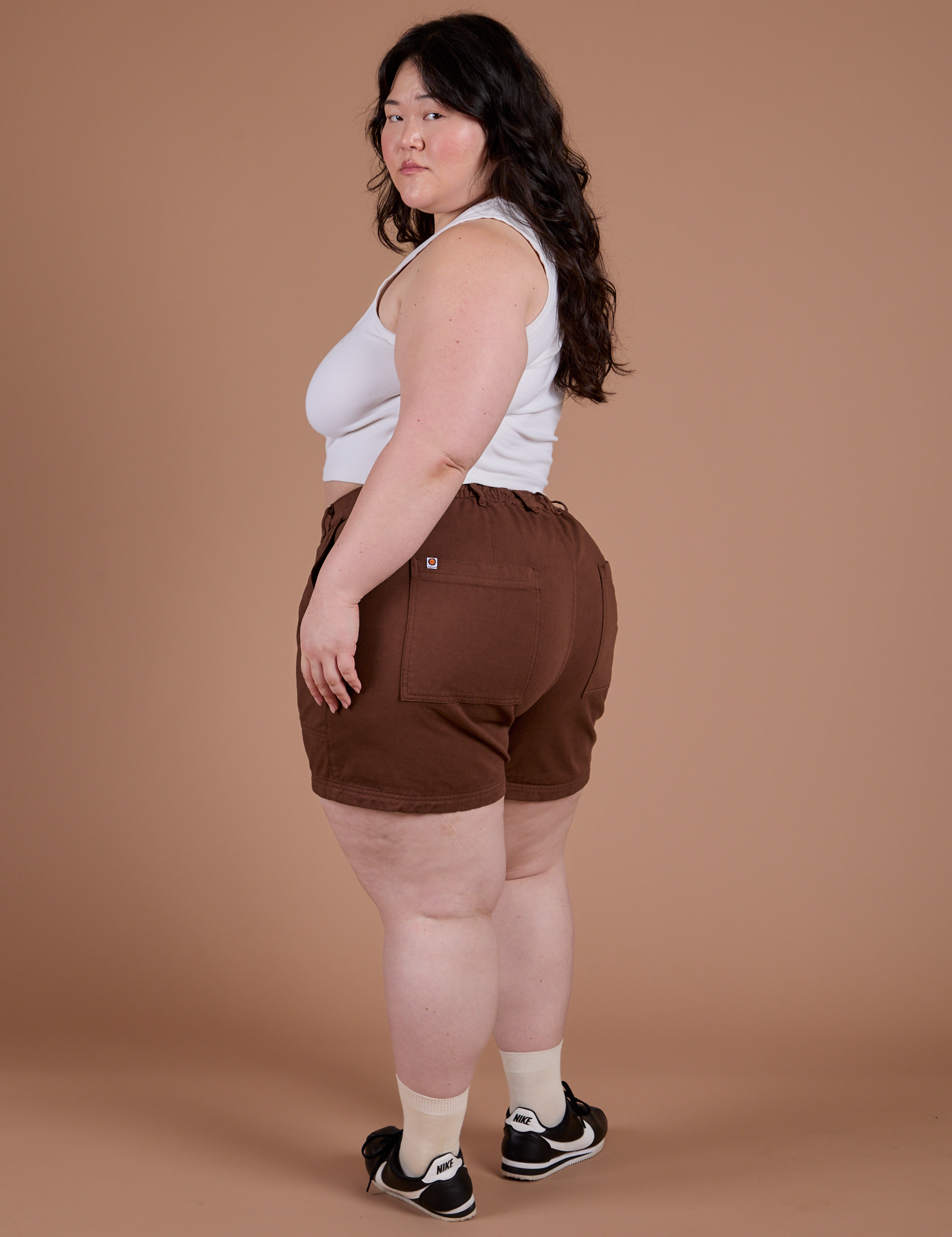 Angled back view of Classic Work Shorts in Fudgesicle Brown on Ashley
