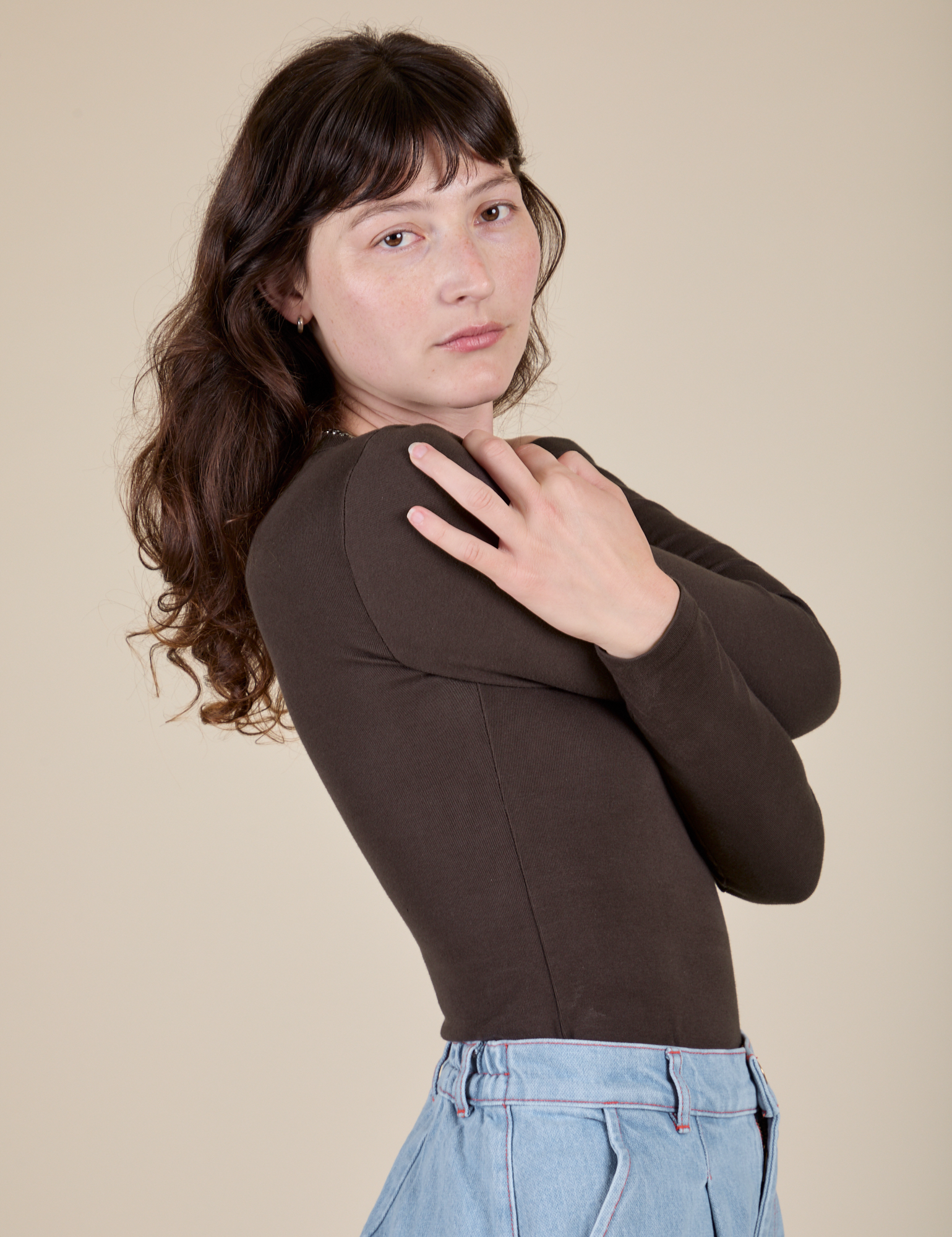 Long Sleeve Baby Tee in Espresso Brown side view on Alex