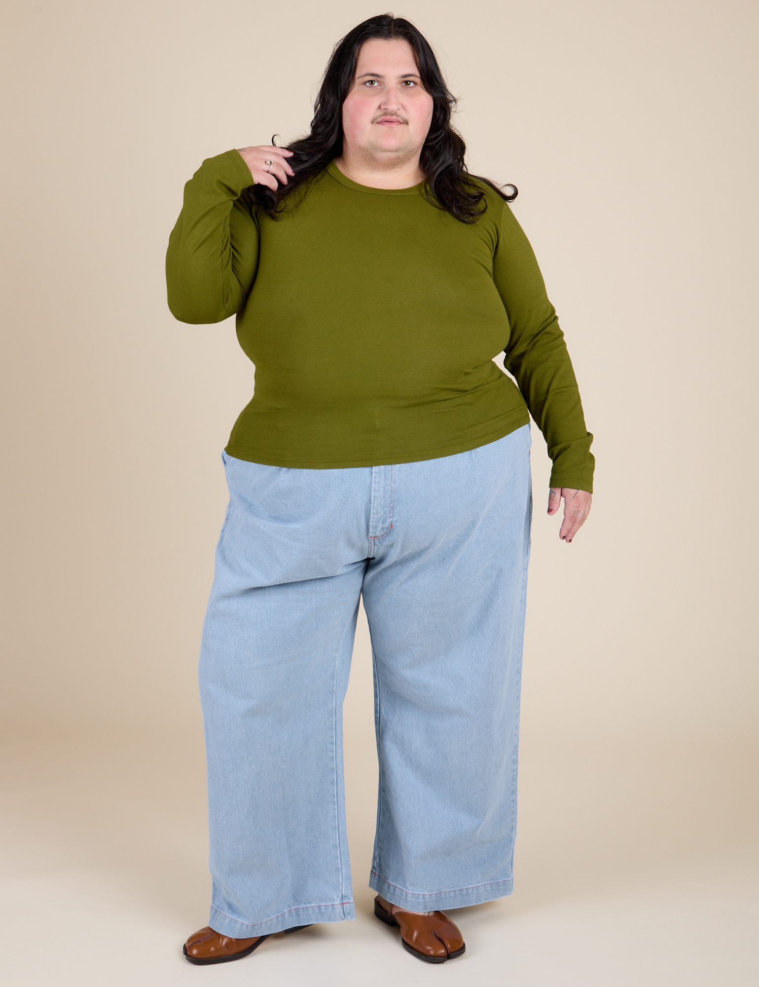 Long Sleeve Baby Tee in Summer Olive and light wash Indigo Wide Leg Trousers on Sam