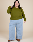 Long Sleeve Baby Tee in Summer Olive and light wash Indigo Wide Leg Trousers on Sam