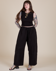 Sydney is wearing Muscle Tee in Basic Black and black Drop Pocket Cargo Pants