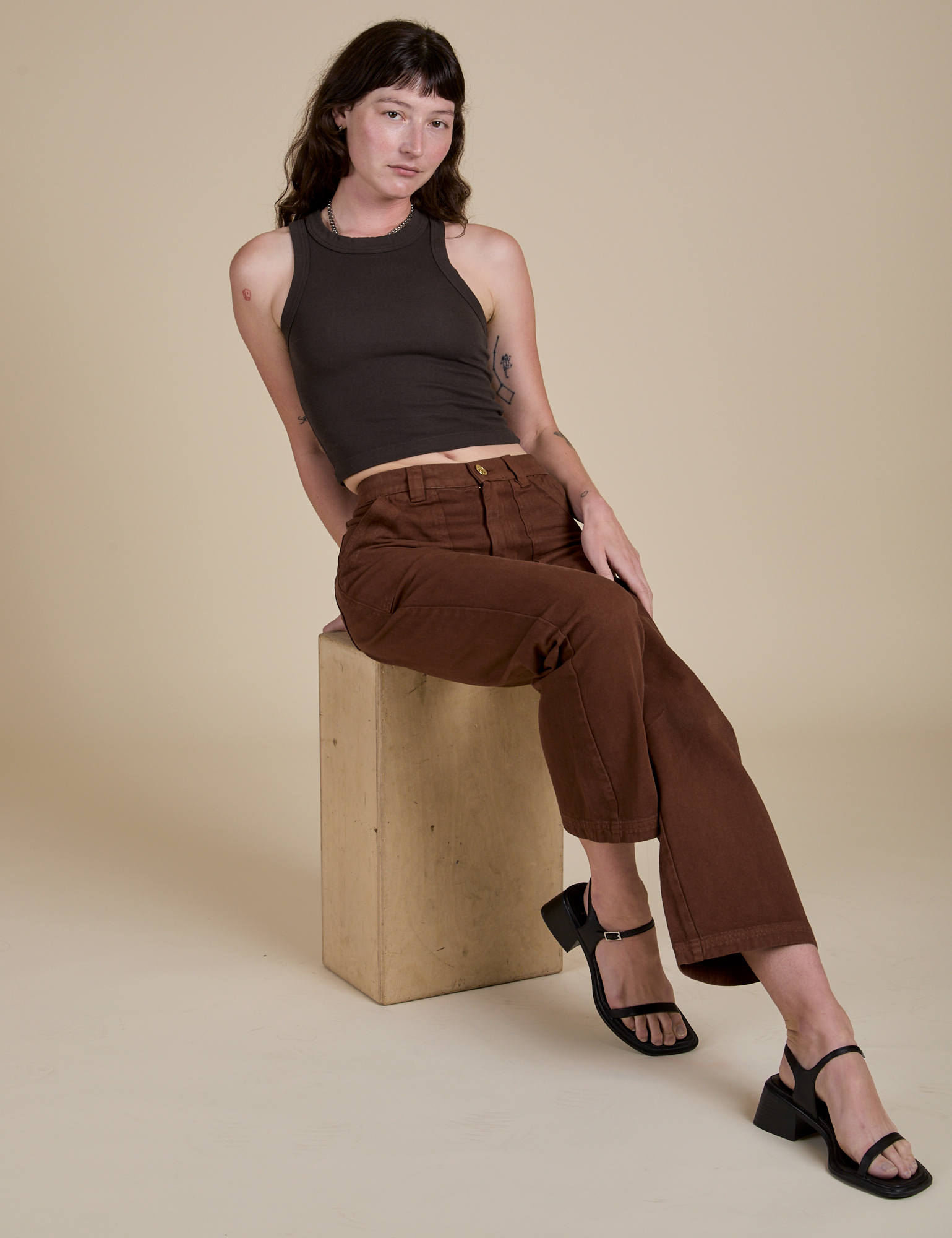 Racerback Tank in Espresso Brown and fudgesicle brown Work Pants on Alex
