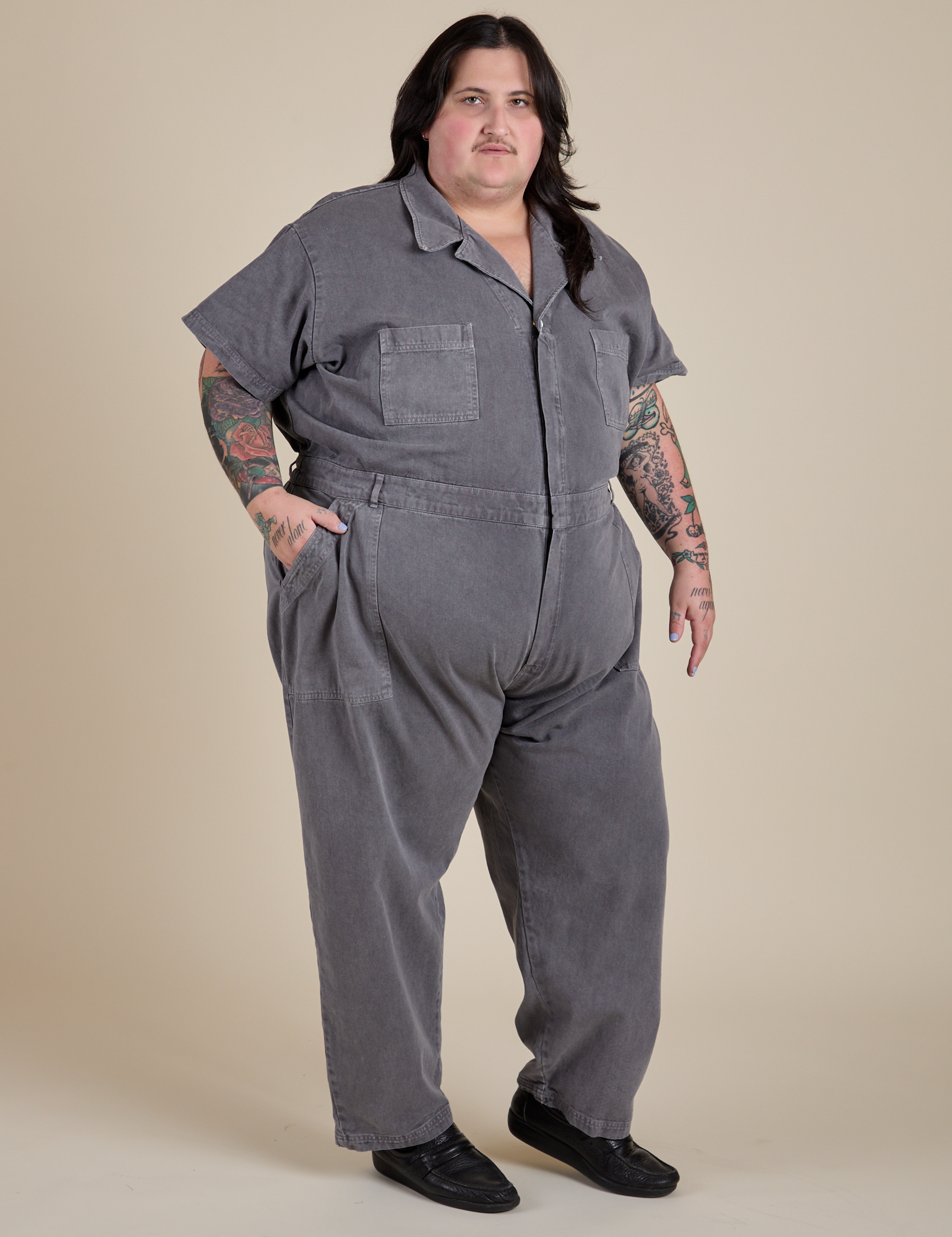 Angled front view of Short Sleeve Jumpsuit in Washed Grey on Sam