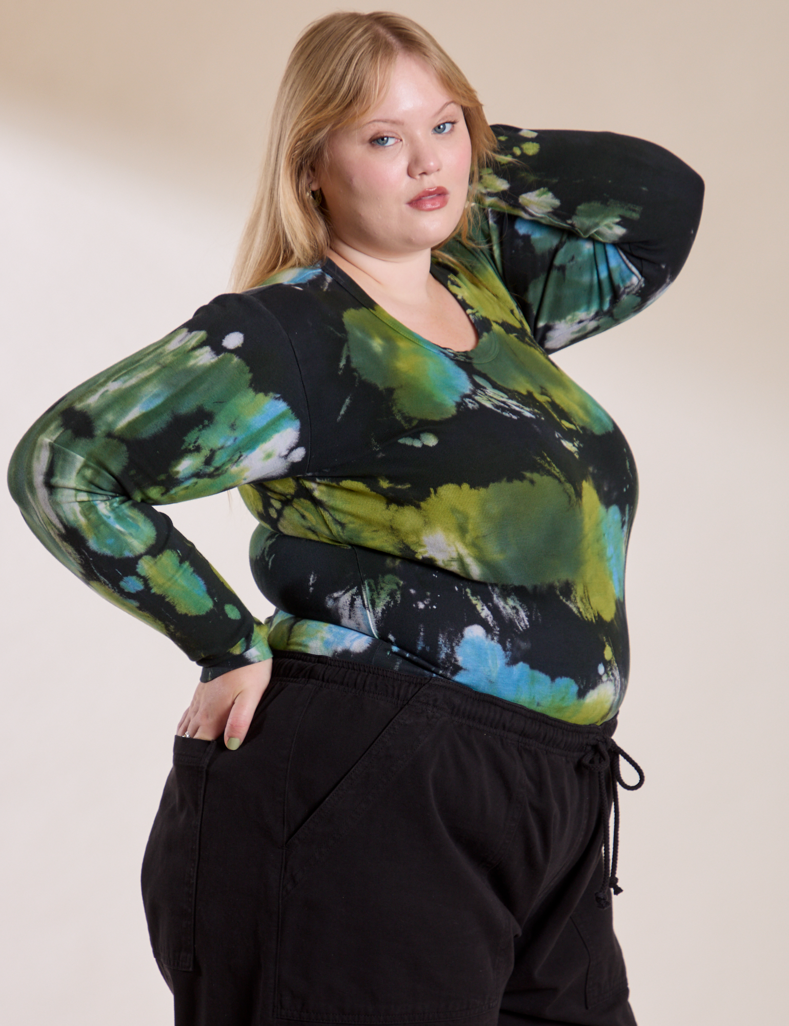Angled front view of Long Sleeve Baby Tee in Green Pool on Juliet