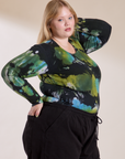 Angled front view of Long Sleeve Baby Tee in Green Pool on Juliet