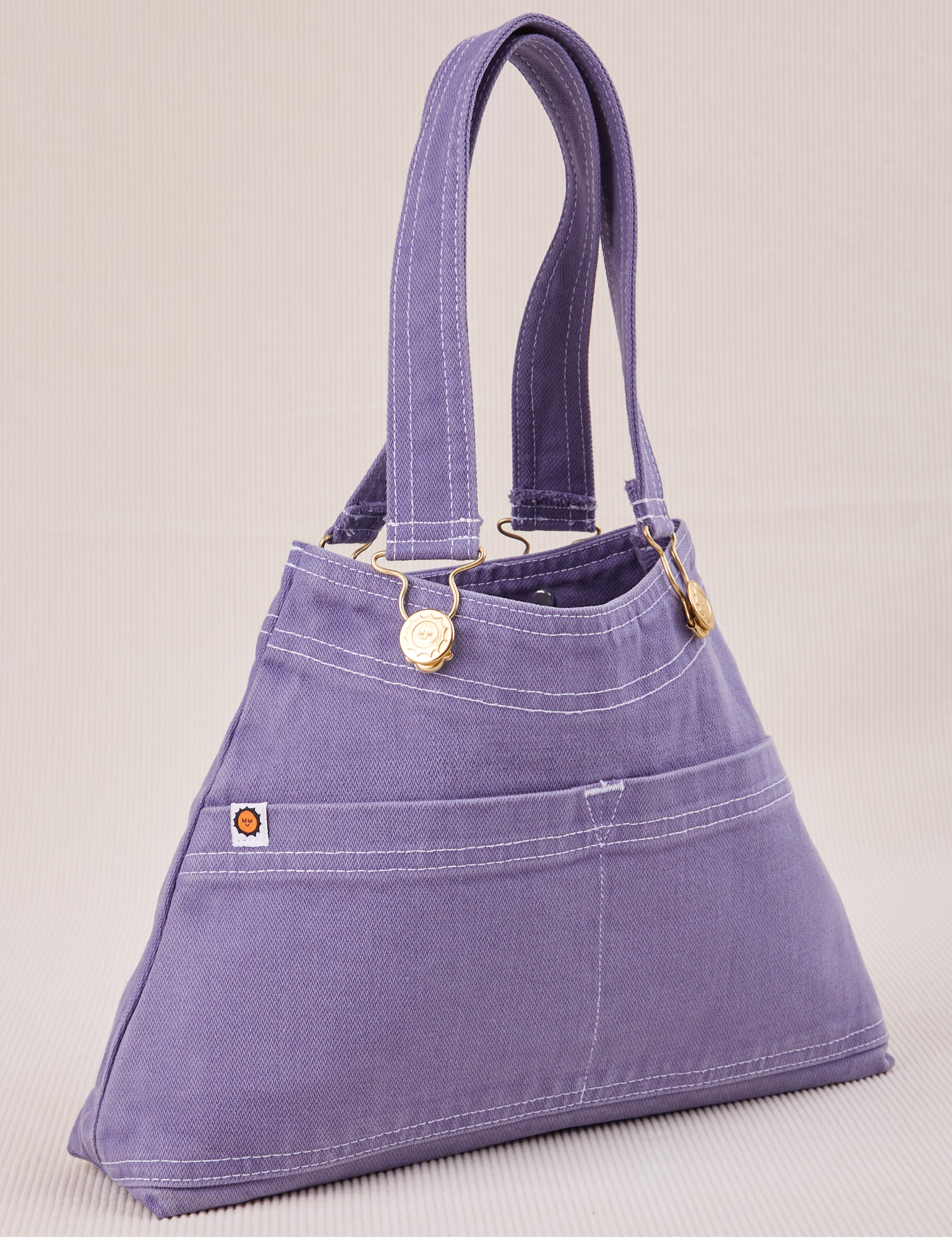 Overall Handbag in Faded Grape angled view