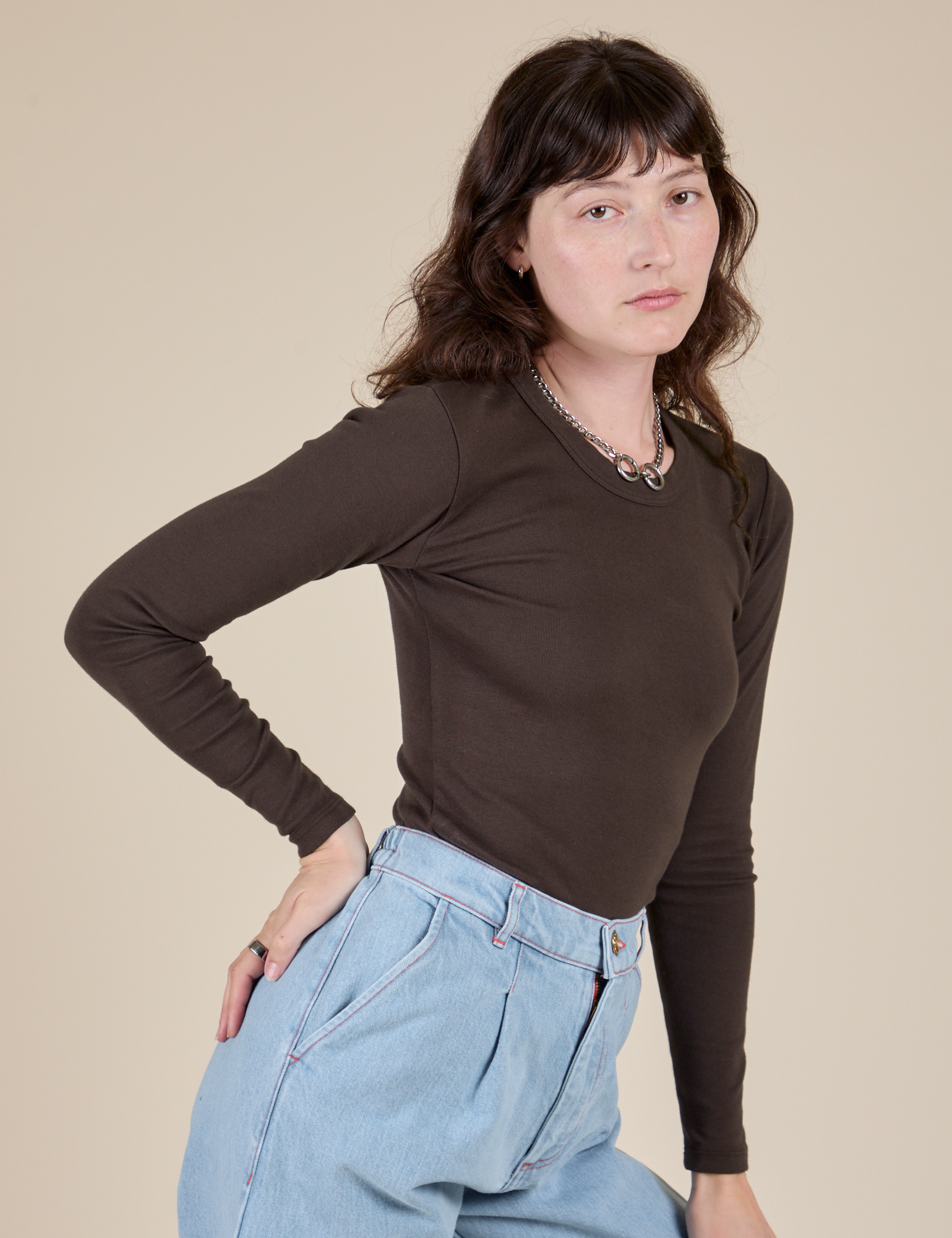 Long Sleeve Baby Tee in Espresso Brown angled front view on Alex