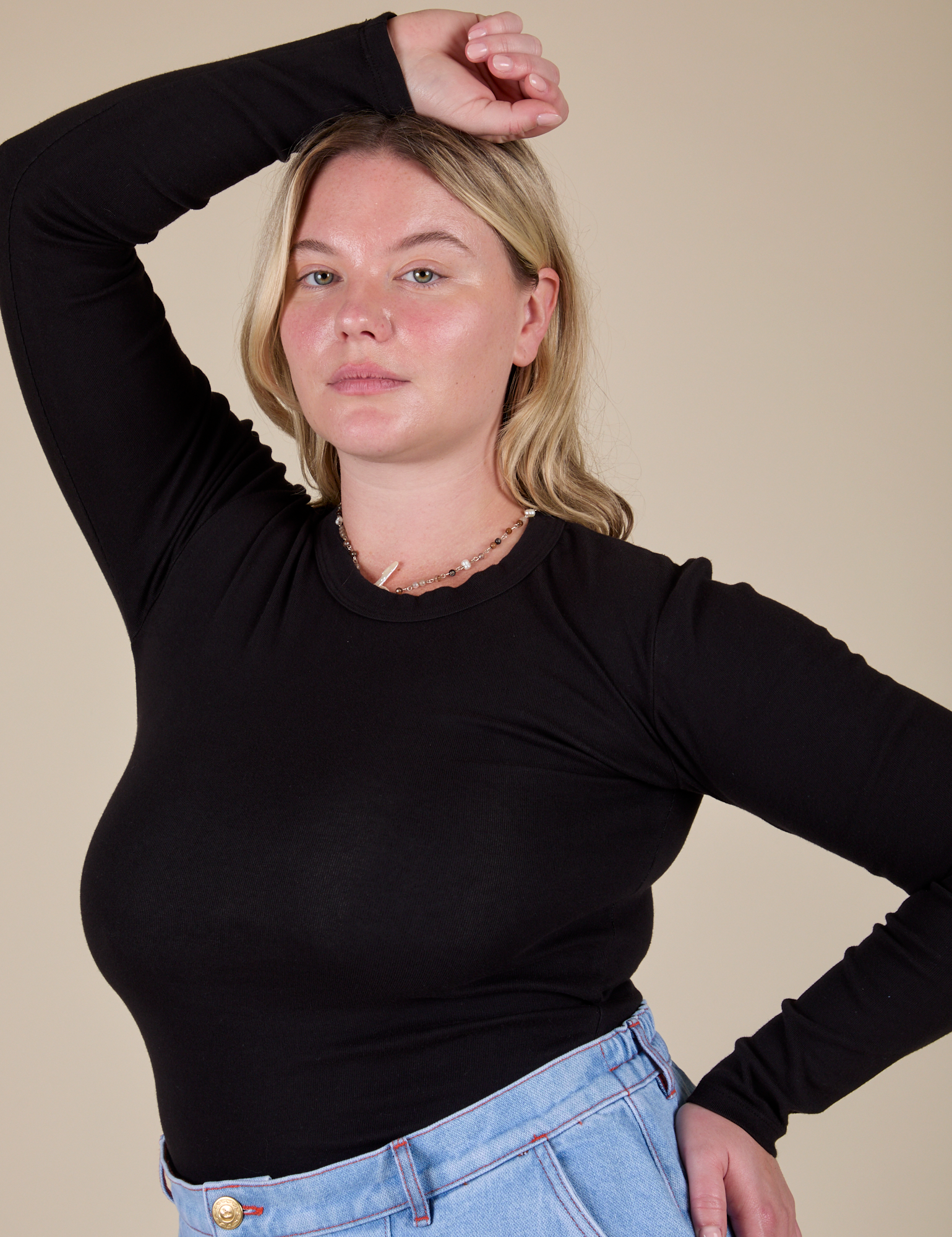 Lish is wearing Long Sleeve Baby Tee in Basic Black