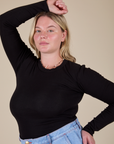 Lish is wearing Long Sleeve Baby Tee in Basic Black