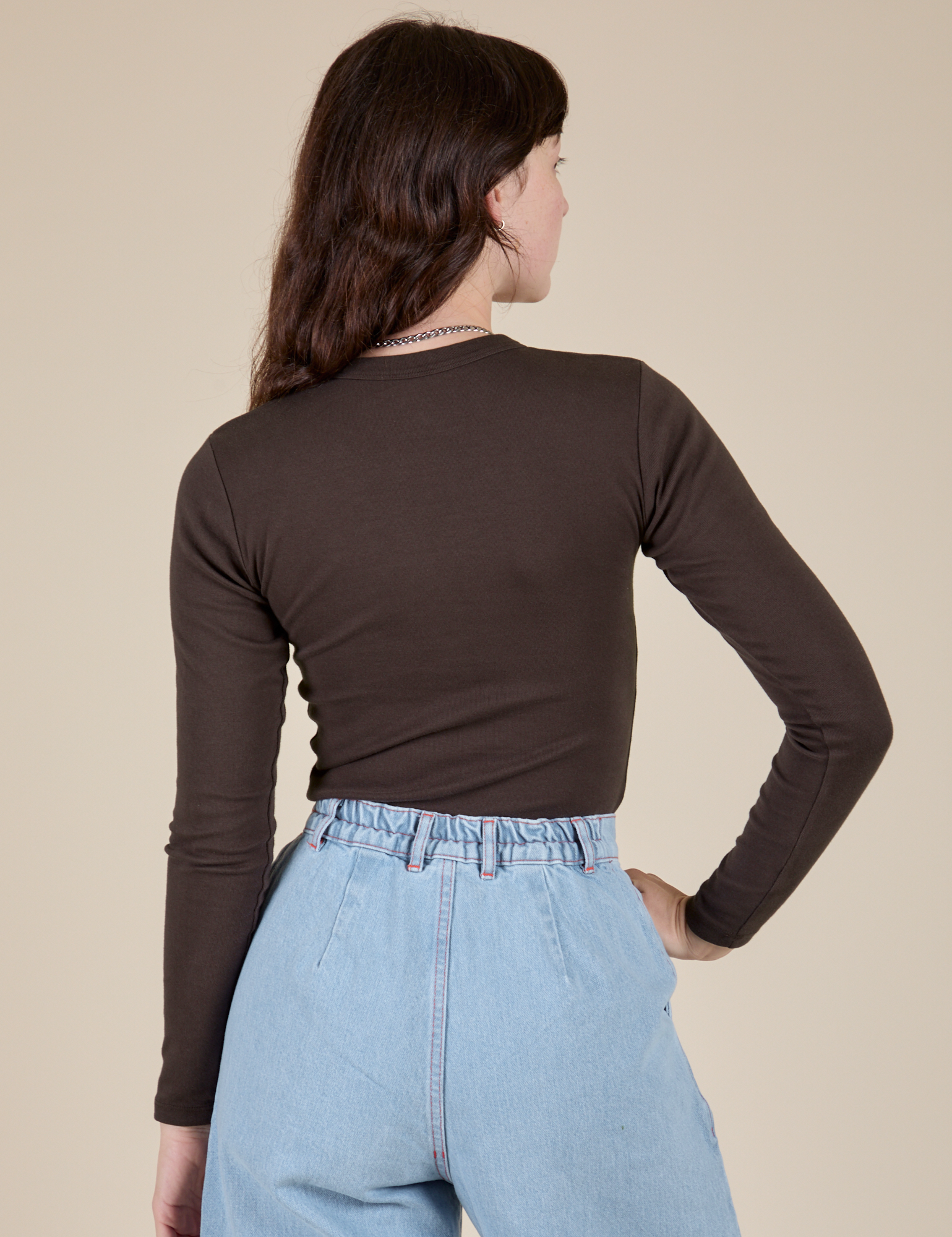 Long Sleeve Baby Tee in Espresso Brown back view on Alex