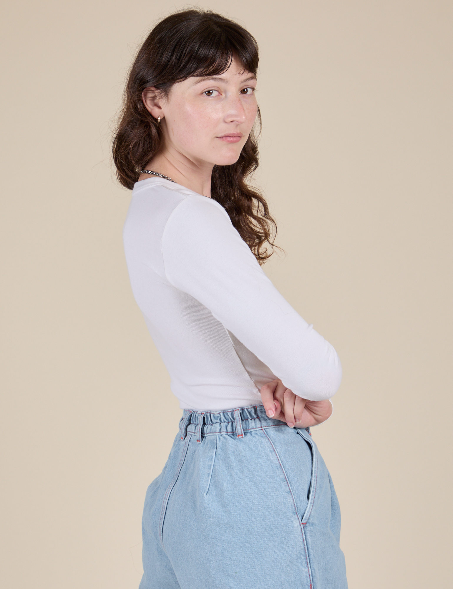 Side view of Long Sleeve Baby Tee in Vintage Tee Off-White on Alex