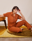 Tiara is wearing Short Sleeve Jumpsuit in Burnt Terracotta