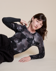 Alex is wearing Long Sleeve Baby Tee in Ink Blot