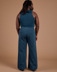 Back view of Action Pants in Lagoon and lagoon Tank Top on Demi
