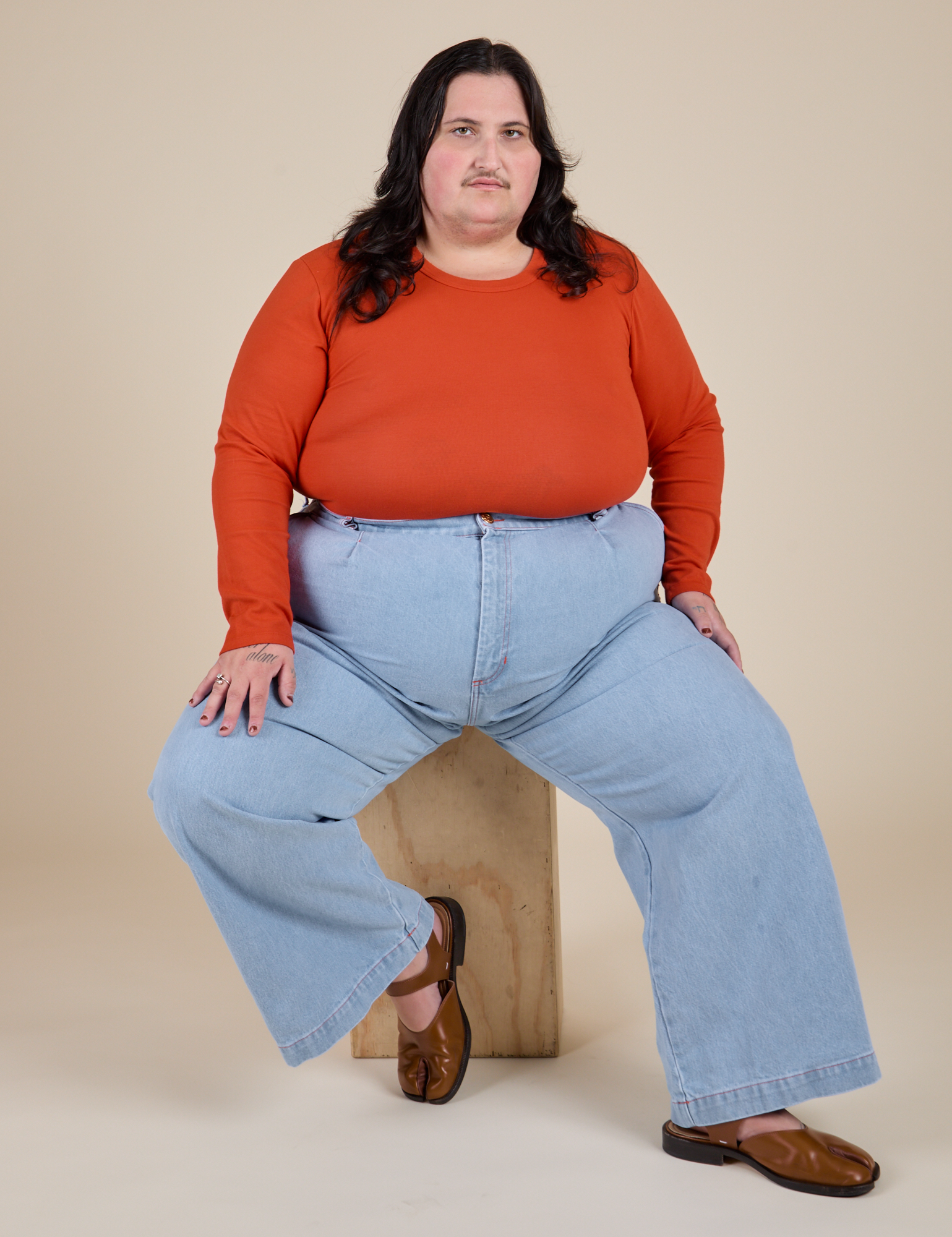 Long Sleeve Baby Tee in Chili Red and light wash Indigo Wide Leg Trousers