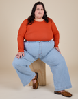 Long Sleeve Baby Tee in Chili Red and light wash Indigo Wide Leg Trousers