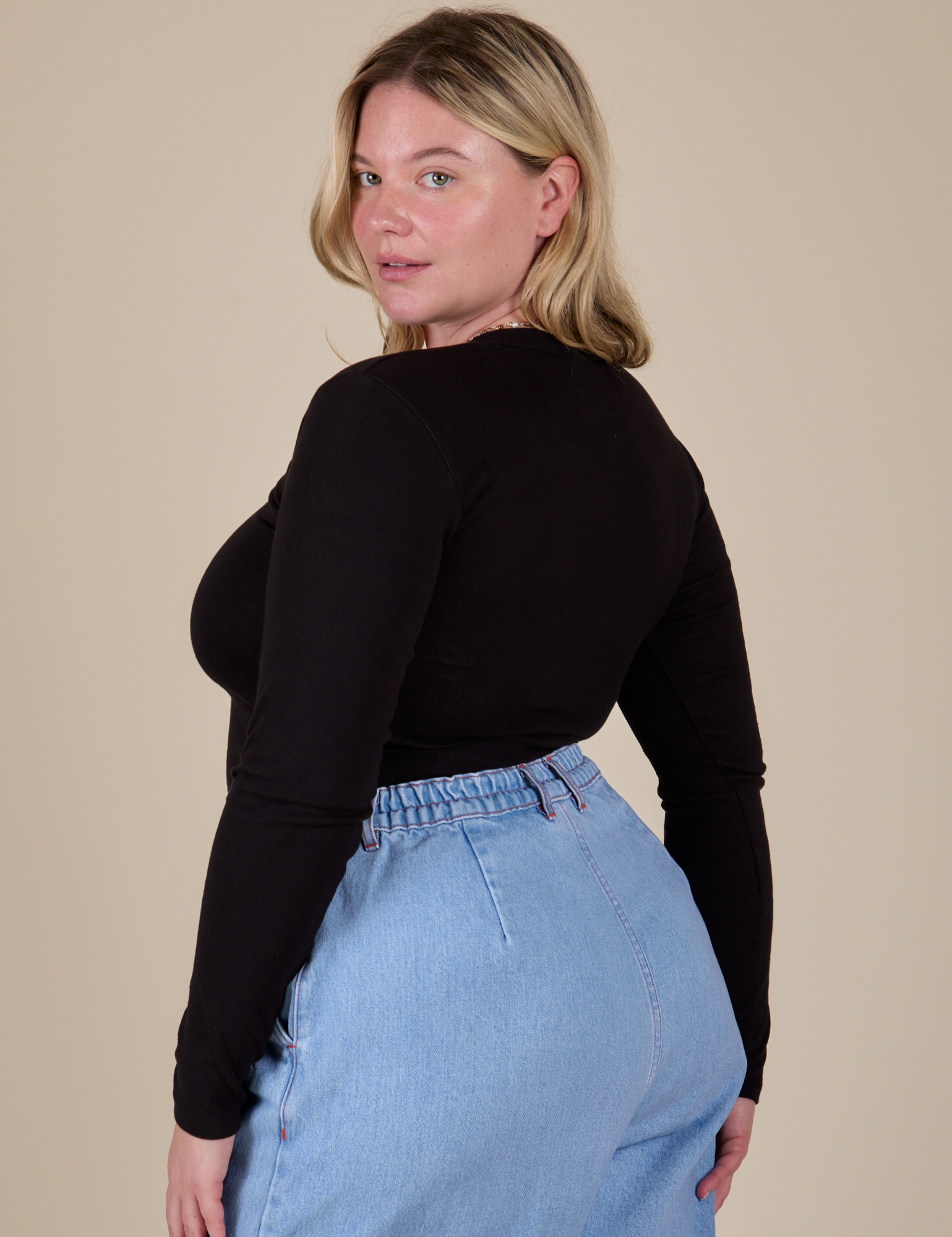 Long Sleeve Baby Tee in Basic Black angled back view on Lish