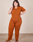 Ashley is 5'7" and wearing 1XL Short Sleeve Jumpsuit in Burnt Terracotta 