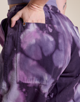 Close up of Alex's hand in the back pocket of Magic Waters Drop Pocket Pants in Dark Lavender